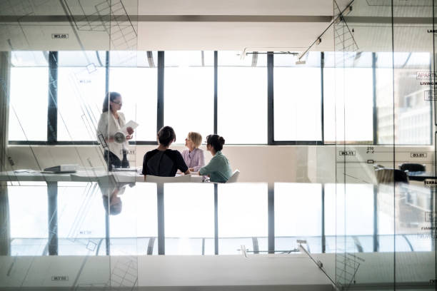 istock Multi-ethnic businesswomen discussing in office 1126842635