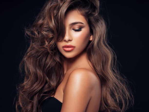 istock Brown haired woman with curly hairstyle 1126843857