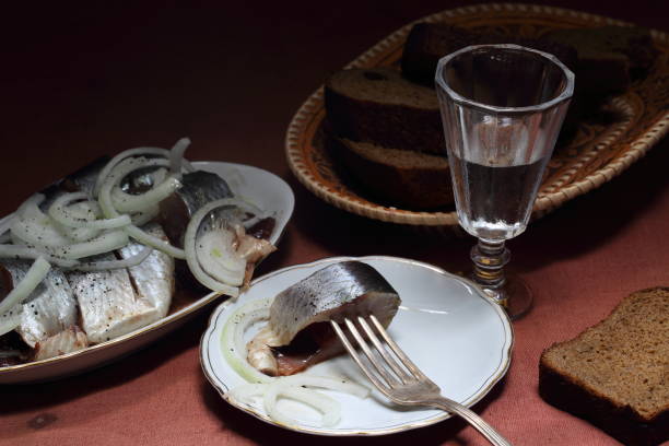 Still life with herring and vodka stock photo