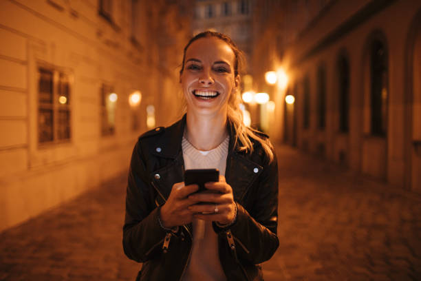 istock Happy girl with a smart phone 1126844542