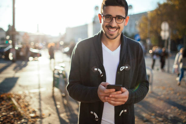 istock Young male with a smartphone 1126844596