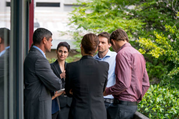 istock Business colleagues discussing on balcony 1126844848