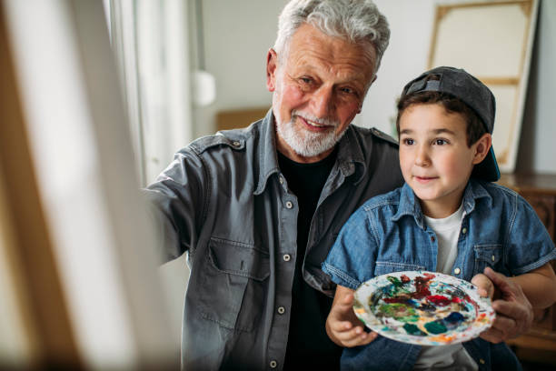 istock Kid and grandparent in an art studio 1126845433