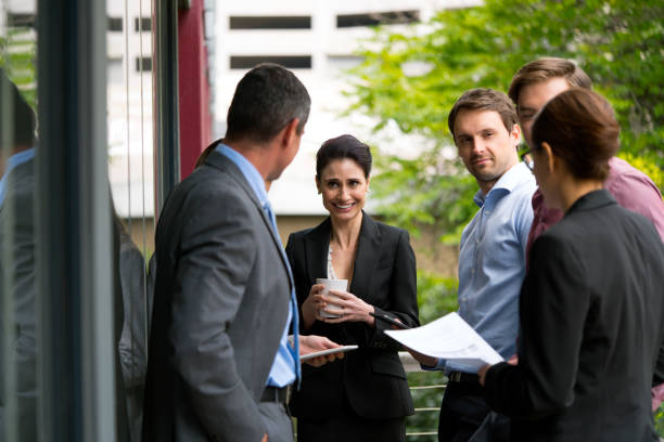 istock Business people discussing on office balcony 1126845440