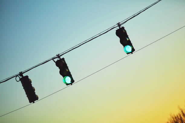 istock Traffic lights at sunset showing green signals 1126845878