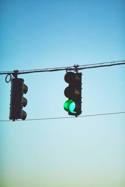 istock Traffic lights with blue sky showing green signals 1126845906
