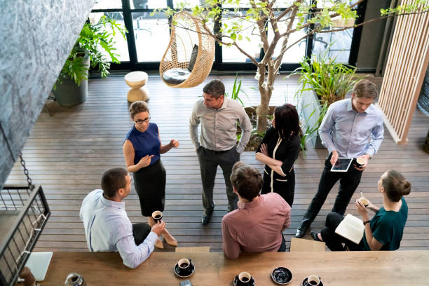istock Business people communicating in cafe 1126845971