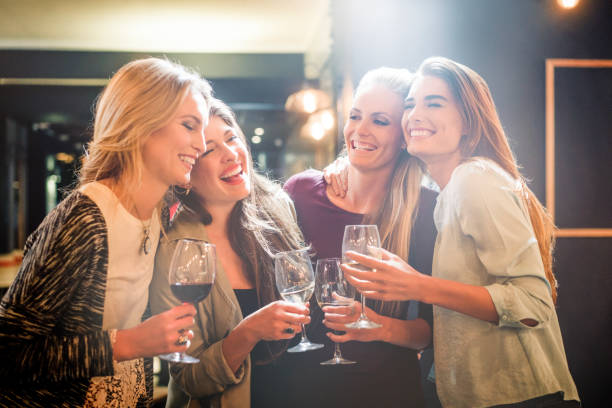 istock Cheerful women enjoying alcohol at restaurant 1126848147
