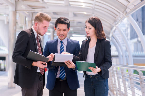 istock Group of business people working and discussing together. 1126849501