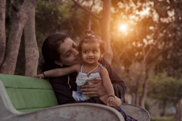 istock mother and daughter in park 1126850505