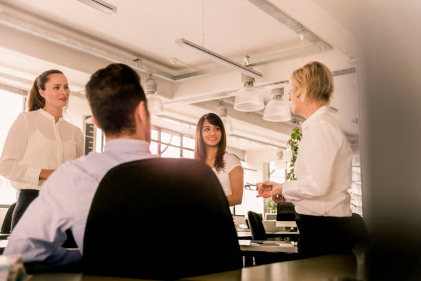 istock Female manager planning with coworkers in office 1126851044