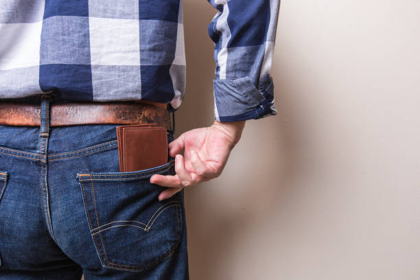 istock Man pulling wallet out of his pants pocket 1126852504