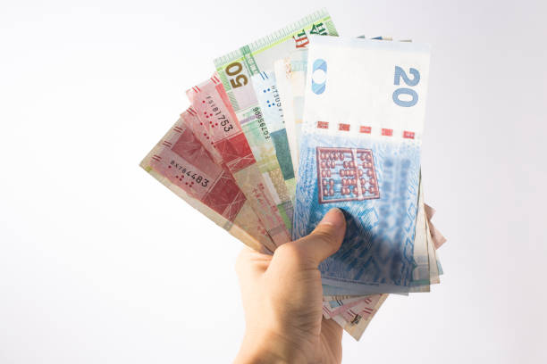 istock Money in the hand. Hand holding Banknotes 1126854514