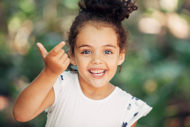 istock Beautiful little girl having fun at the park 1126854657