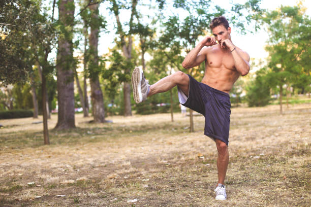 Muscular man exercising martial arts. About 25 years old, Caucasian male.