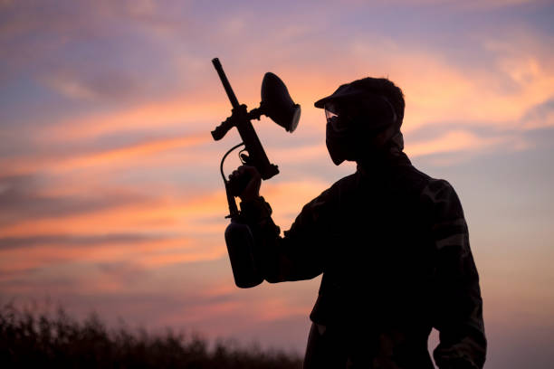 istock Silhouette of a paintball player 1126858695