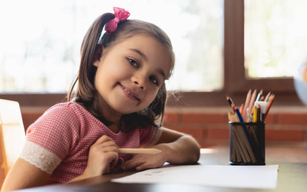 istock Little Girl Drawing Picture 1126858720