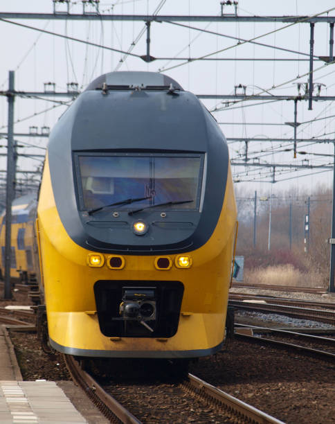 istock Intercity train type DDRM double decker at railroad track between Gouda and The Hague at the station of Gouda. 1126859659