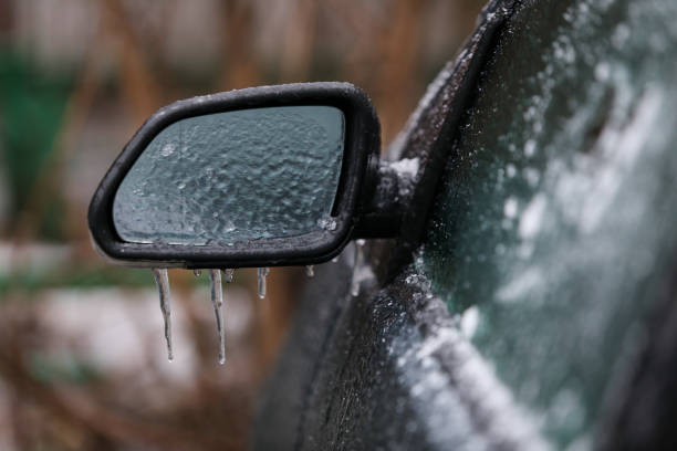 istock Car frozen side mirror after freezing rain 1126859868