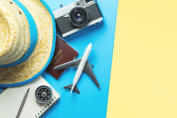 istock Travel accessories objects and gadgets top view flatlay on blue yellow 1126860157