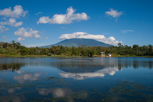 Reflection of Dempo Mountain on Tebat Gheban Lake, Pagaralam, South Sumatra, Indonesia