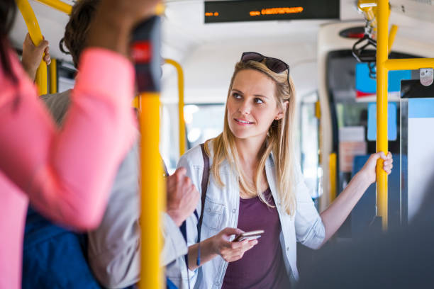istock Female backpacker looking at male in bus 1126861019