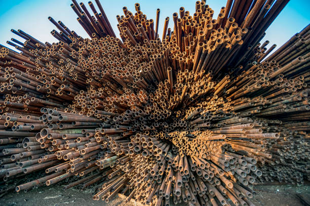 istock bunch of rust pipes is made one by one 1126861401