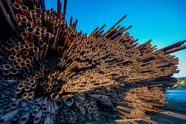istock bunch of rust pipes is made one by one 1126861430