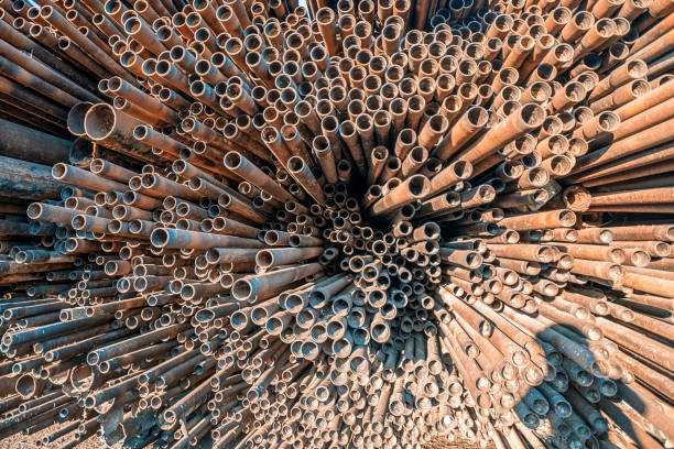 istock bunch of rust pipes is made one by one 1126861431