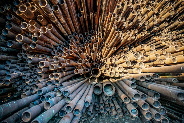 istock bunch of rust pipes is made one by one 1126861434
