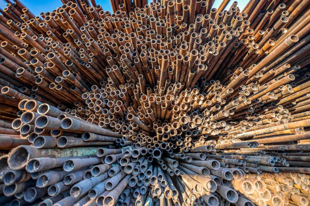 istock bunch of rust pipes is made one by one 1126861436