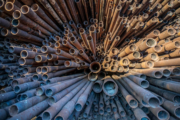 istock bunch of rust pipes is made one by one 1126861441
