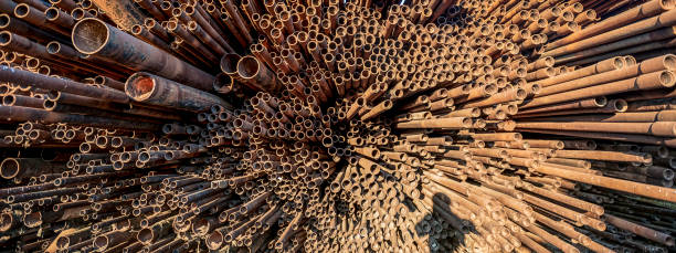 istock bunch of rust pipes is made one by one 1126861444