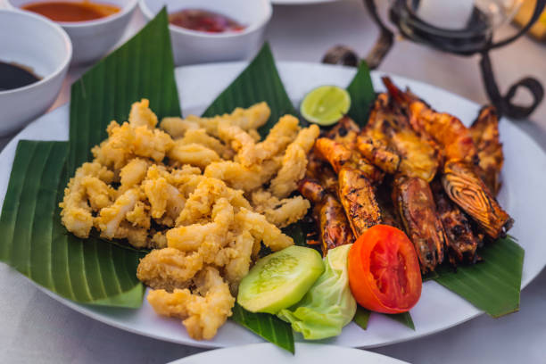 istock Fried seafood for lunch in Jimbaran Bay, Bali 1126862419
