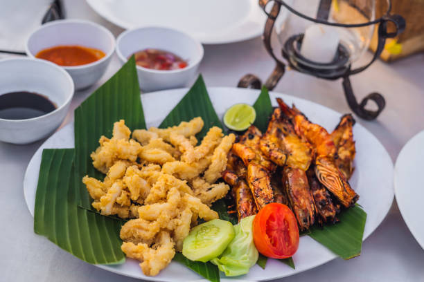 istock Fried seafood for lunch in Jimbaran Bay, Bali 1126862422