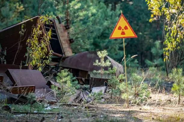 sign of radiation hazard on the background of radioactive garbage