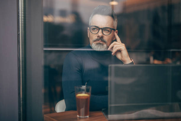 istock Mature man sitting in the coffee shop 1126865486