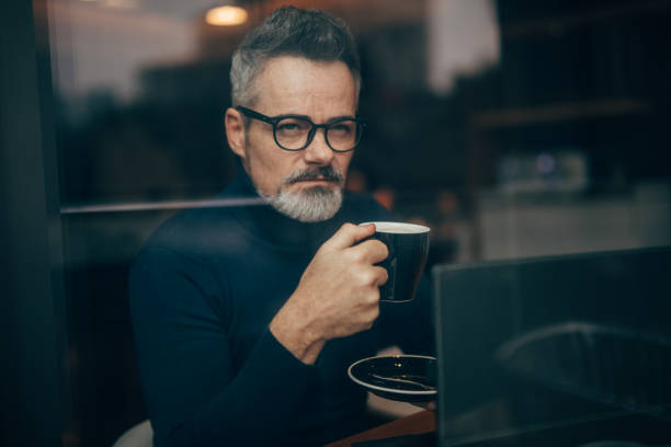 istock Mature man in the coffee shop 1126866614