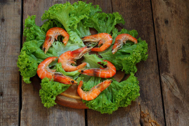 istock King prawns on lettuce leaves on wooden background 1126867144