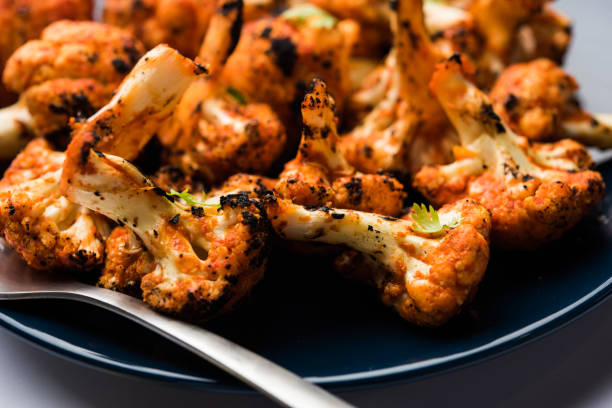 Tandoori Gobi / Roasted cauliflower Tikka is a starter food from India. served with ketchup. selective focus stock photo