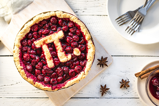 Pi Day Cherry Pie - Homemade Traditional Cherry Pie with Pi sign for March 14th holiday.