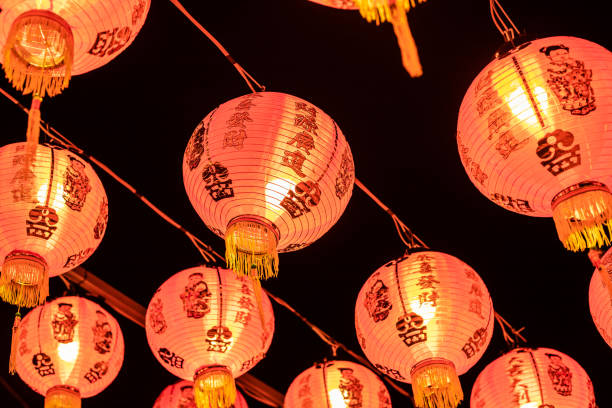 istock a collapsible paper lantern in bright colours, primarily red, used for decorative purposes, commonly painted with Chinese art. 1126872605