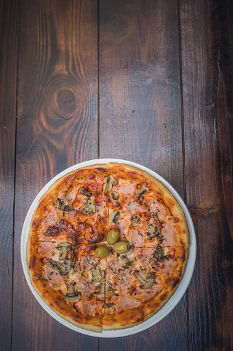 Pizza Capricciosa on a table