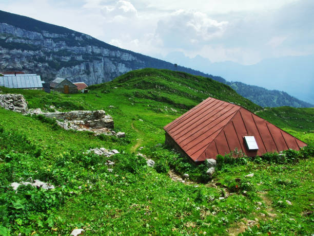 Farms and pastures on tableland mountain ranges Alpstein