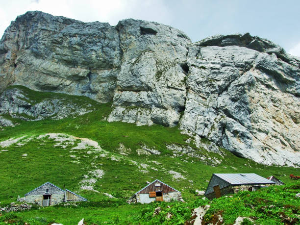 Farms and pastures on tableland mountain ranges Alpstein