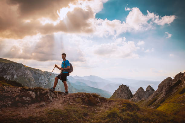 istock man on the top of a rock 1126874066