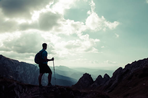istock man on the top of a rock 1126874116