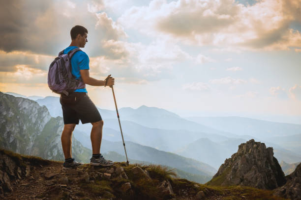 istock man on the top of a rock 1126874660