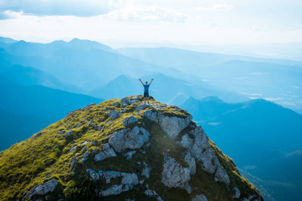 istock man on the top of a rock 1126875770