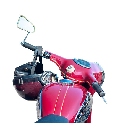 old model's motorcycle, red with chrome elements, retro helmet on the steering wheel, isolated on white background